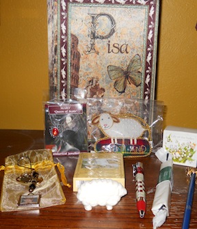 Inside the lovely wooden box: Mary Queen of Scots necklace, sheep ornament, Treasuring Theresa keychain in bag, bar of soap, bath crystals, sheep soap, pen, pencil, Castles and Palaces of Scotland playing cards